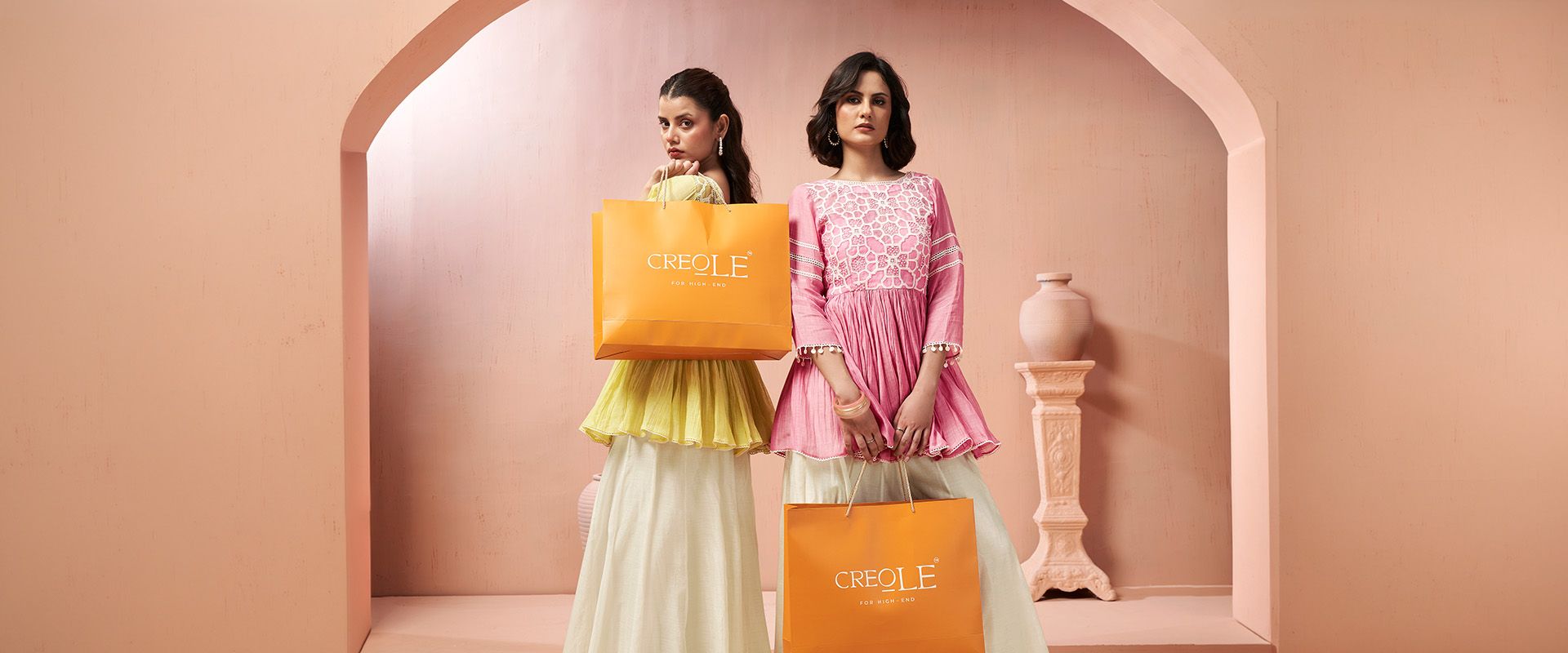 Creole homepage banner featuring models in luxury handcrafted designer ethnic wear for women