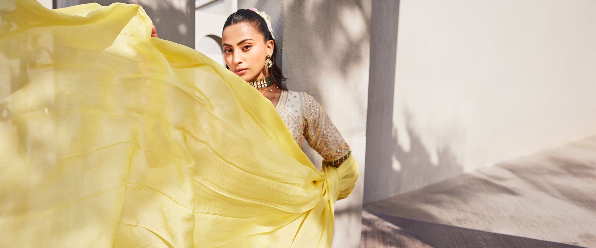 Creole luxury ethnic wear collection banner showcasing models in designer handcrafted sarees and silk outfits
